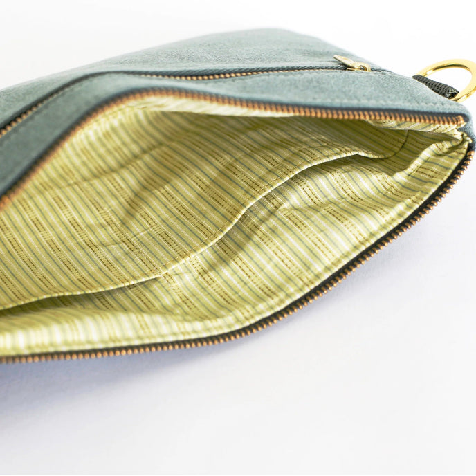 Green Interior stripe pattern 3-in-1  bag  with gold zipper on a white background