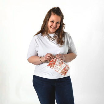 Lifestyle shot of Burnt Orange Wristlet