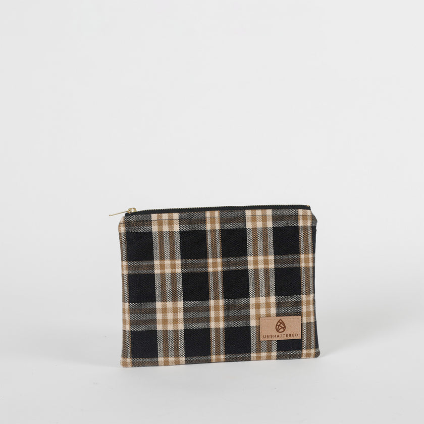 Plaid pouch with a visible brand logo on a white background