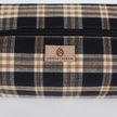 Plaid patterned bag with 'Unshattered' brand logo on a white background