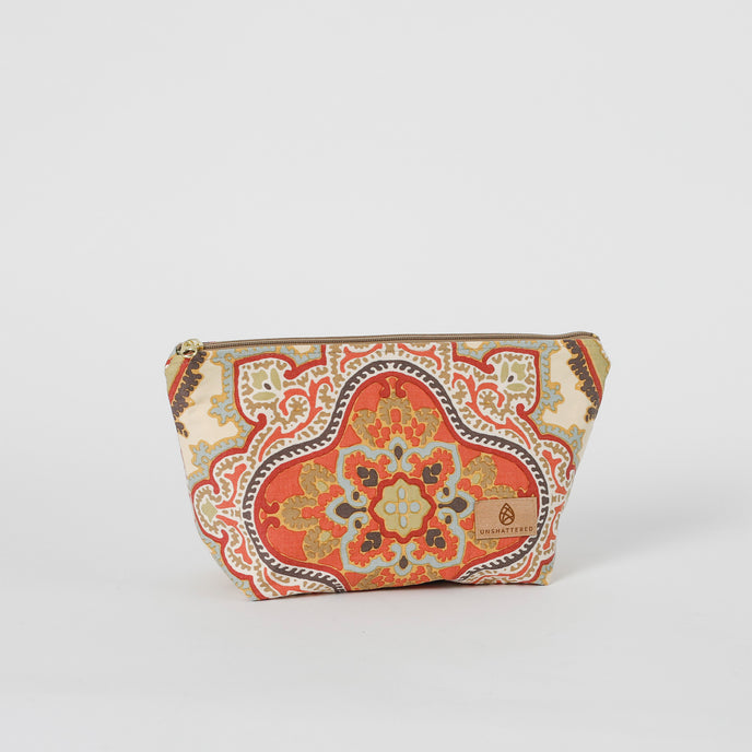 Patterned makeup bag with a decorative design on a white background