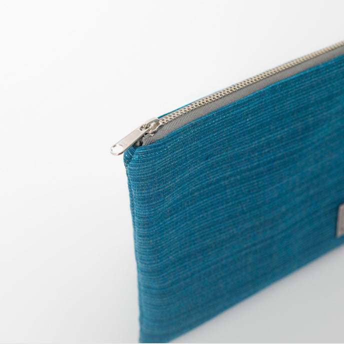 Blue pouch with a zipper on a white background