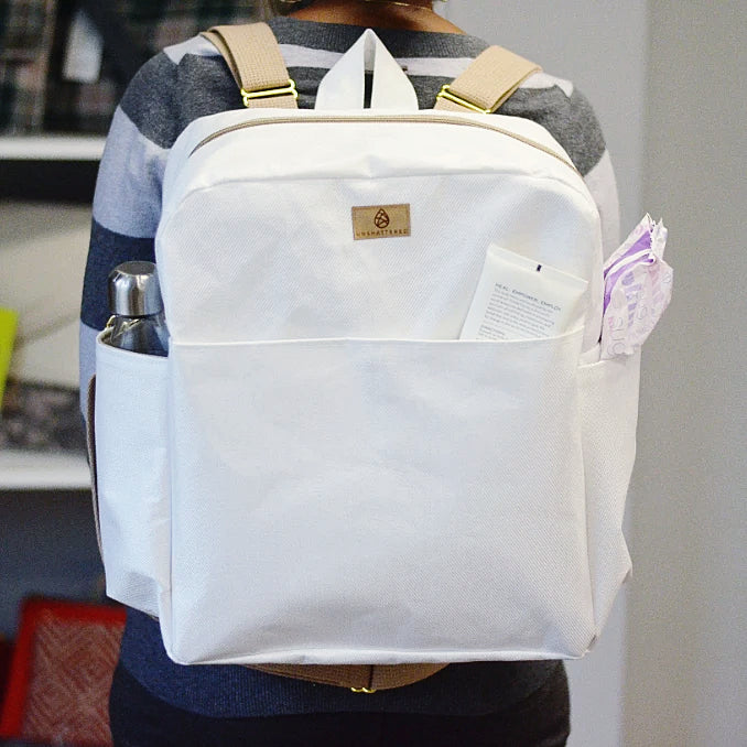 woman wearing convertible roller blind vertical backpack
