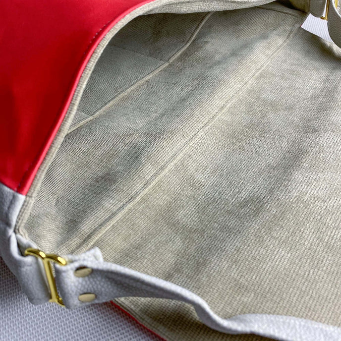A beige velvet interior of a formula e racing material large messenger