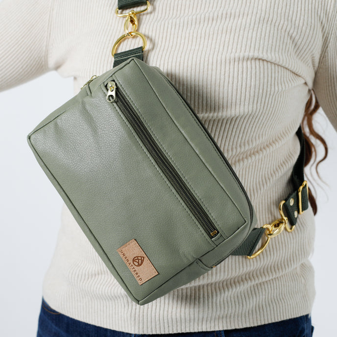 A close-up of the green luxury leather alternative errand bag named after Tasha