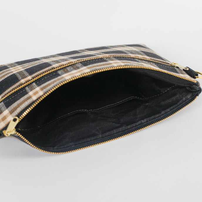 Plaid pouch with black fabric interior  on a white background