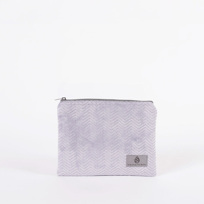 Light Purple Textured pouch with a zipper on a white background
