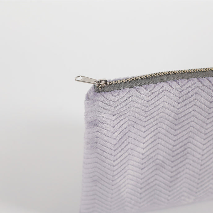 Close-up of a gray zipper on a white background