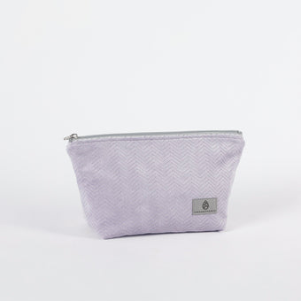 Light Purple Textured Makeup with a zipper on a white background