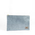 A blue velvet large zip pouch named after Laura with gold-tone hardware, featuring a suede Unshattered label.