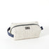 A white two toned twill weave toiletry kit with a zipper closure and a label on the front.