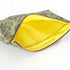 A yellow fabric interior on a green and brown floral large zip pouch 