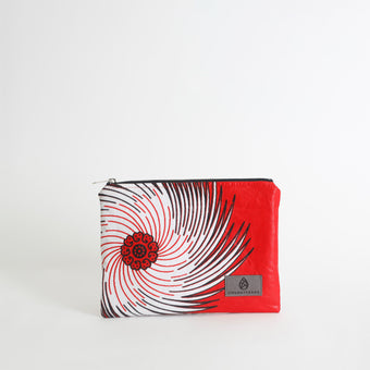 Red and black patterned pouch with a brand logo on a white background named after Aiyannah 
