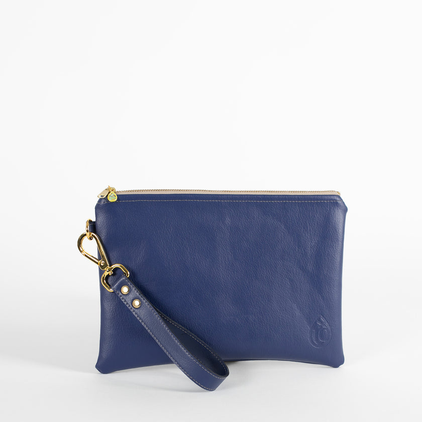Blue anniversary wristlet with a gold tear drop clip with a tan zipper and Unshattered emblem. 
