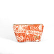 Orange and white marble patterned makeup bag on a white background