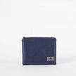Black and blue luxury leather alternative zip pouch with a gray Unshattered label in the right corner.