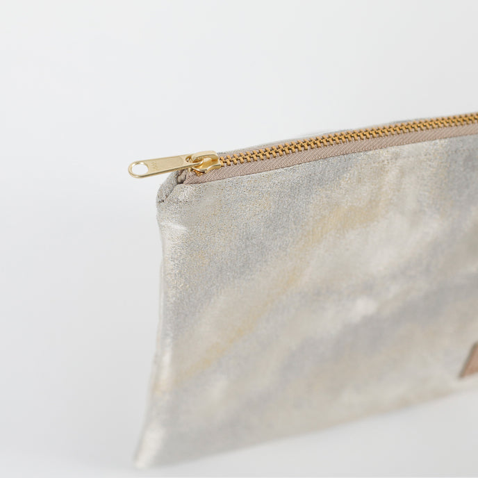 Zip pouch with gold zipper on a white background named after Billy