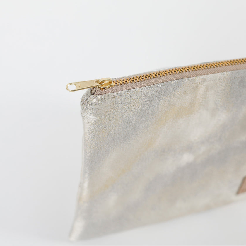 Zip pouch with gold zipper on a white background named after Billy