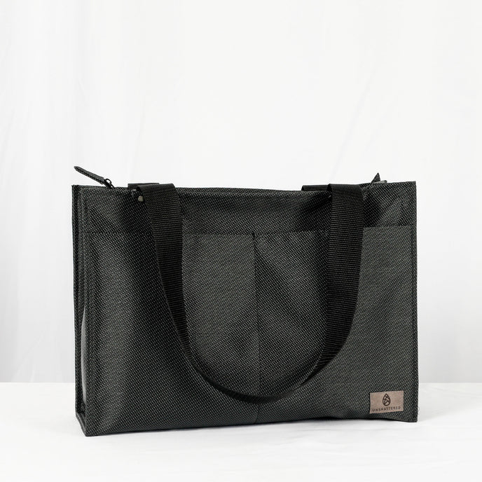 Three Zip Shopper Totes in beige, black, and gray, displayed side by side with a visible zippered closure and handle straps.