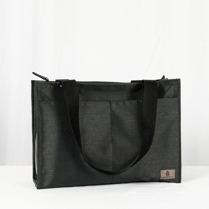 Three Zip Shopper Totes in beige, black, and gray, displayed side by side with a visible zippered closure and handle straps.