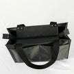 A black zippered shopper tote with.a black zipper and hardware 