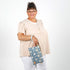 Lifestyle shot of person holding wristlet 