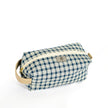 A blue and white plaid toiletry kit with a tan zipper and hardware, displayed against a white background.