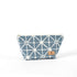 Blue geometric patterned makeup bag named Erin with a suede Unshattered label on a white background