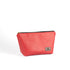 A bright red makeup bag handcrafted from upcycled materials with a black zipper and gold hardware on a white background
