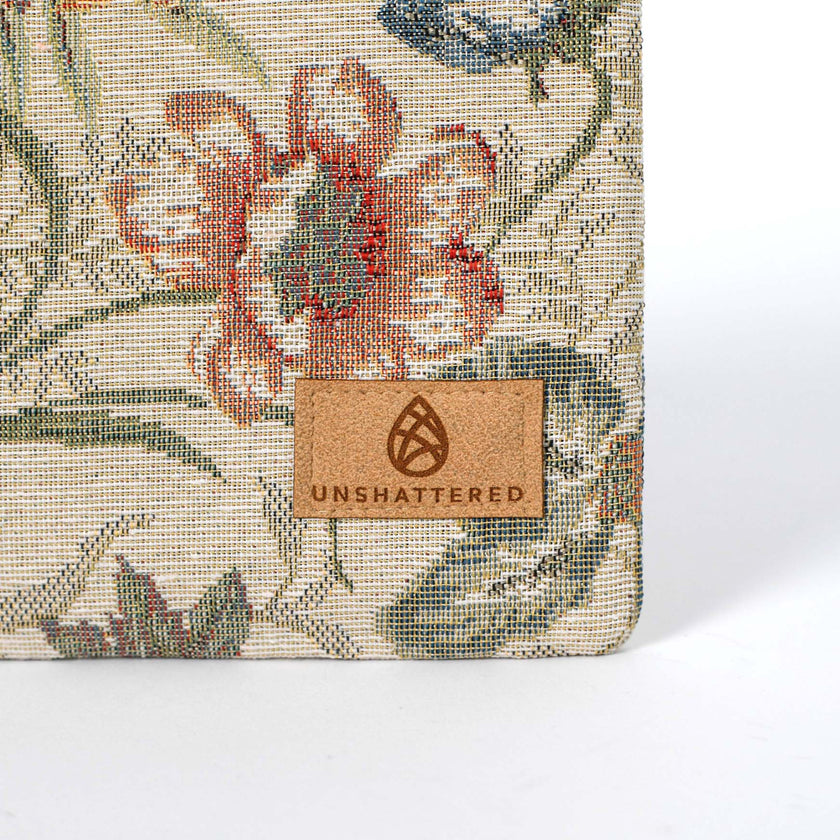 Product with floral pattern and 'Unshattered' brand label on a white background named after Cathy zip pouch 