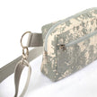Close up of silver-toned hardware on an Unshattered Errand Bag handcrafted from an upcycled US Army digital camo uniform