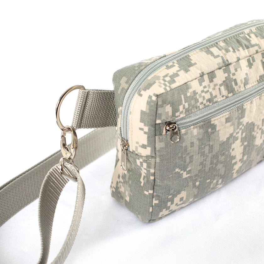 Close up of silver-toned hardware on an Unshattered Errand Bag handcrafted from an upcycled US Army digital camo uniform