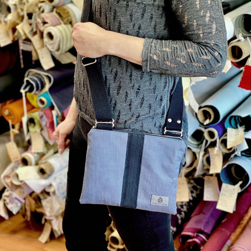 lifestyle shot of dress gray crossbody