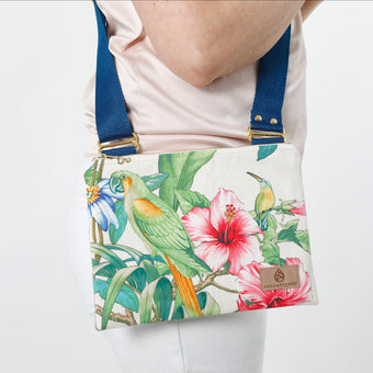 Bag with tropical floral design and parrot illustration worn over shoulder named after Daliana
