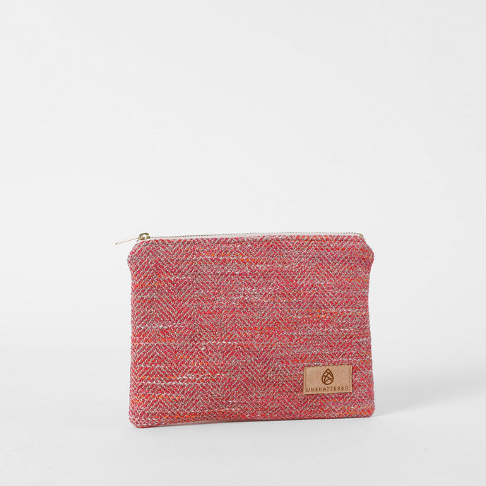 Pink pouch with a brand logo on a white background named after Dariene