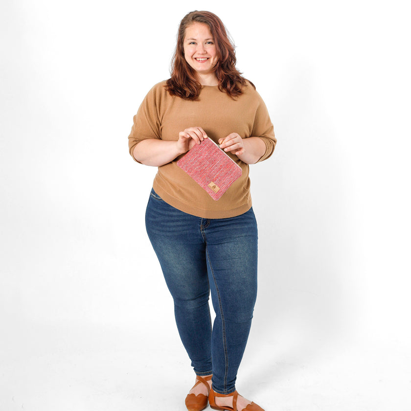 Woman holding a pink product against a white background named after Dariene