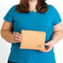 A woman holding a beige suede zip pouch named after Deborah 