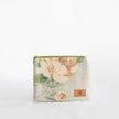A floral print zip pouch with a gold-tone zipper closure and a Unshattered on the front named after Diane.