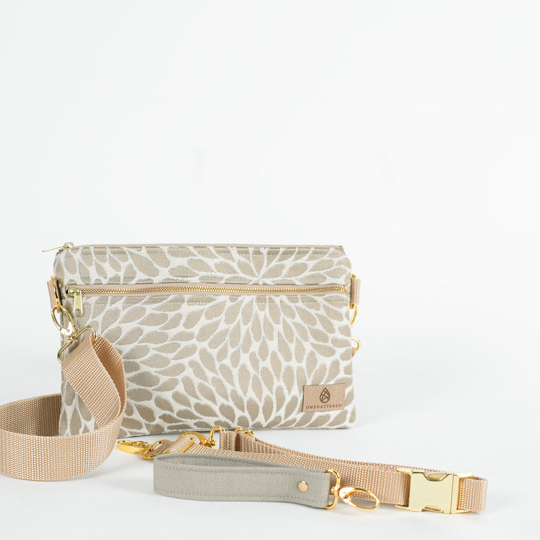 Plato's petal design 3-in-1 Bag: Cream and green with gold hardware, featuring a green luxury leather alternative material for the wristlet strap.