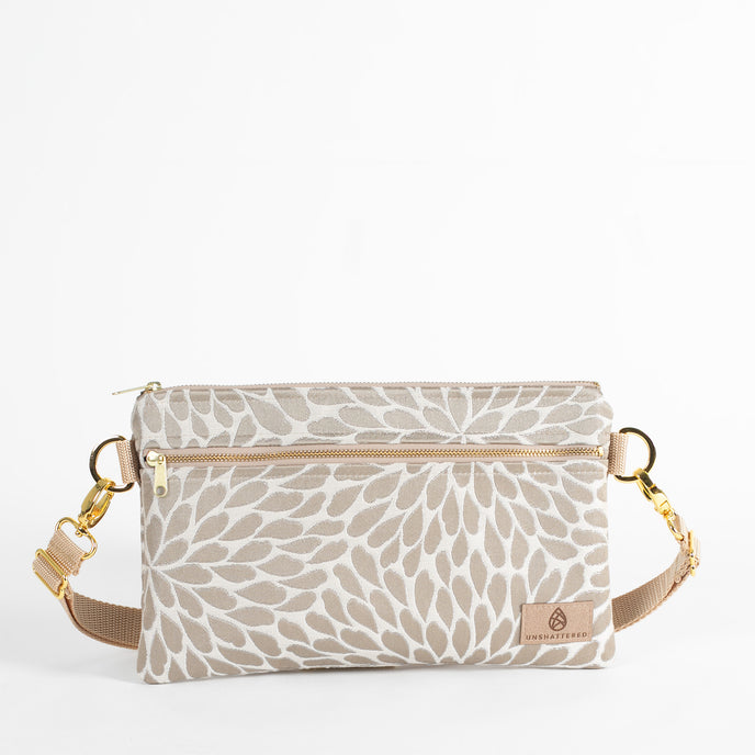 This platos petal design 3-in-1 bag with a gold hardware belt bag style