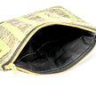 A black fabric interior of a lime green design zip pouch named after Eileen.