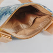 Open beige striped fabric on this teal whisper crossbody pouch with a gold tone zipper. 