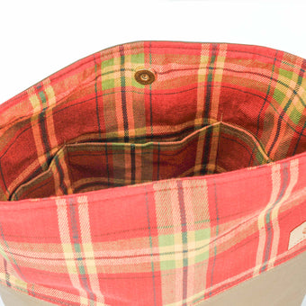 A red plaid tote interior with three pockets 