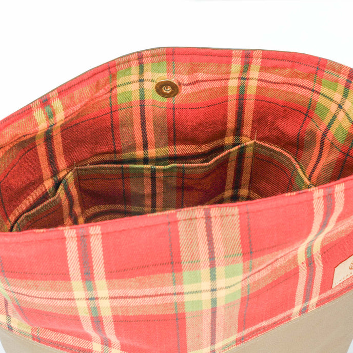 A red plaid tote interior with three pockets 