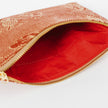 Red Interior of zip pouch with gold zipper on a white background named after Faith 