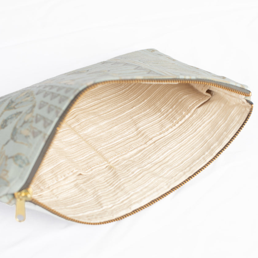 A white striped interior fabric with a blue print design on the exterior