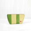 A green multi-panel makeup bag with a zip closure, made from luxury leather alternative material, displayed against a white background named after Gail.