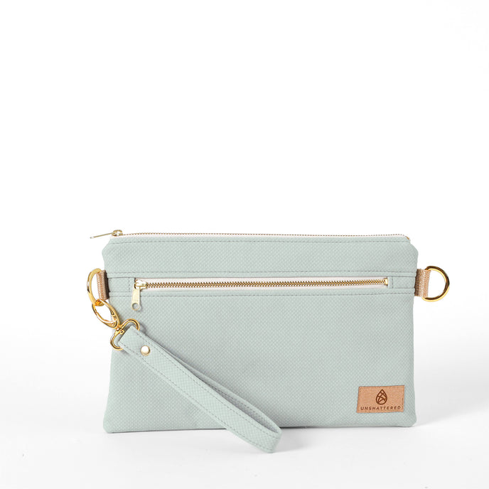 George 3-in-1 Bag handcrafted from light blue wipe-clean material with a light blue wristlet strap