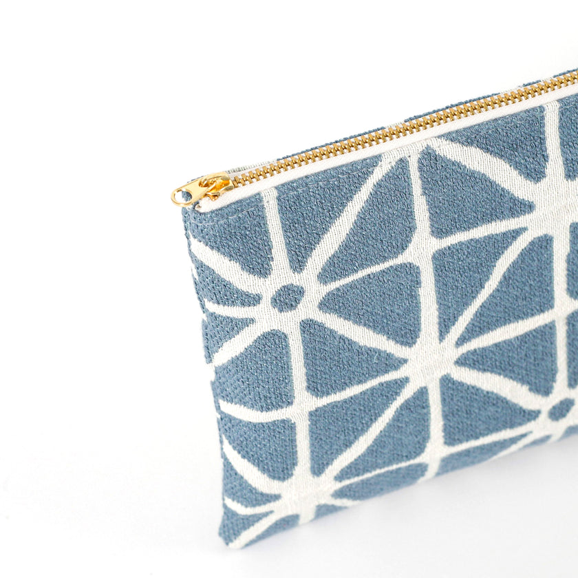 Gold-tone zipper on the Erica Zip Pouch  handcrafted from upcycled blue patterned fabric