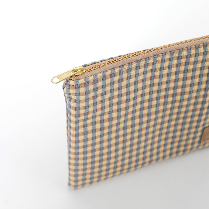 Gold-tone zipper on checked Kara Zip Pouch by Unshattered